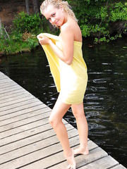 showing off her hot body on the dock by the river Pic 1